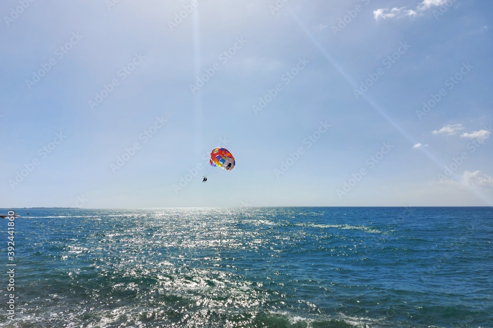 Parachute over the sea in sunny summer weather. High quality photo