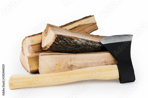 Firewood and an axe on a white isolated background. Renewable energy resource. Ecological concept photo