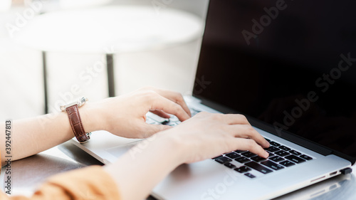 person typing on a laptop keyboard