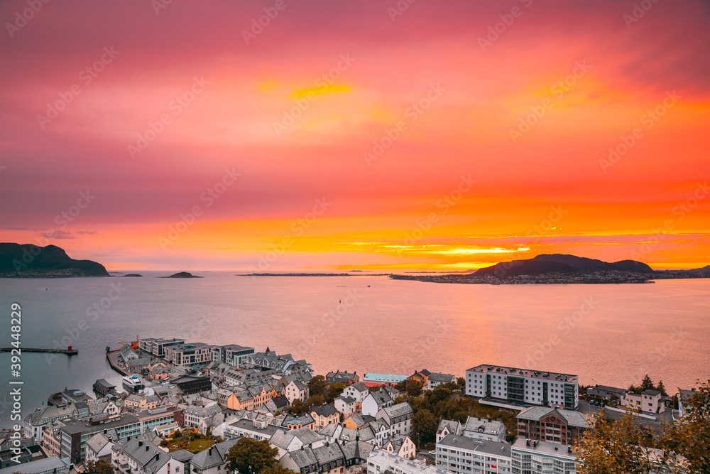 Alesund, Norway. Amazing Natural Bright Dramatic Sky In Warm Colours Above Alesund Valderoya And Islands In Sunset Time. Colorful Sky Background. Beauty In Norwegian Nature