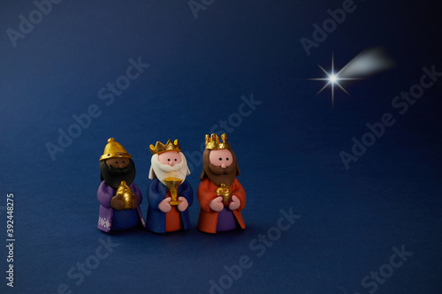 Photographie Happy Epiiphany day. Three wise man ant star on blue background.