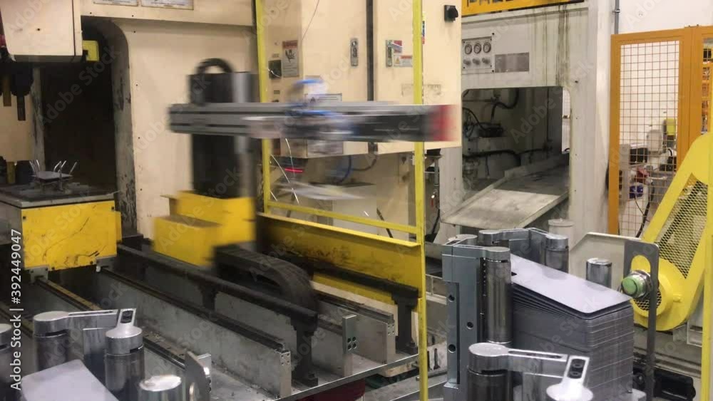 Robot car factory. Steel metal production with machine on automotive manufacture plant. Industry technology.Bending sheet metal with a hydraulic machine. Robot car factory. Steel metal production with machine on automotive manufacture plant. Industry technology.Bending sheet metal with a hydraulic machine.