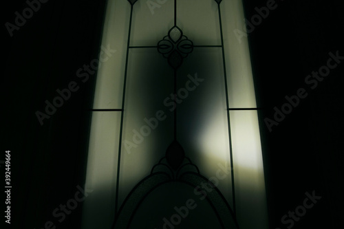 A silhouette man standing behind the door, Thriller concept, Blurred edit