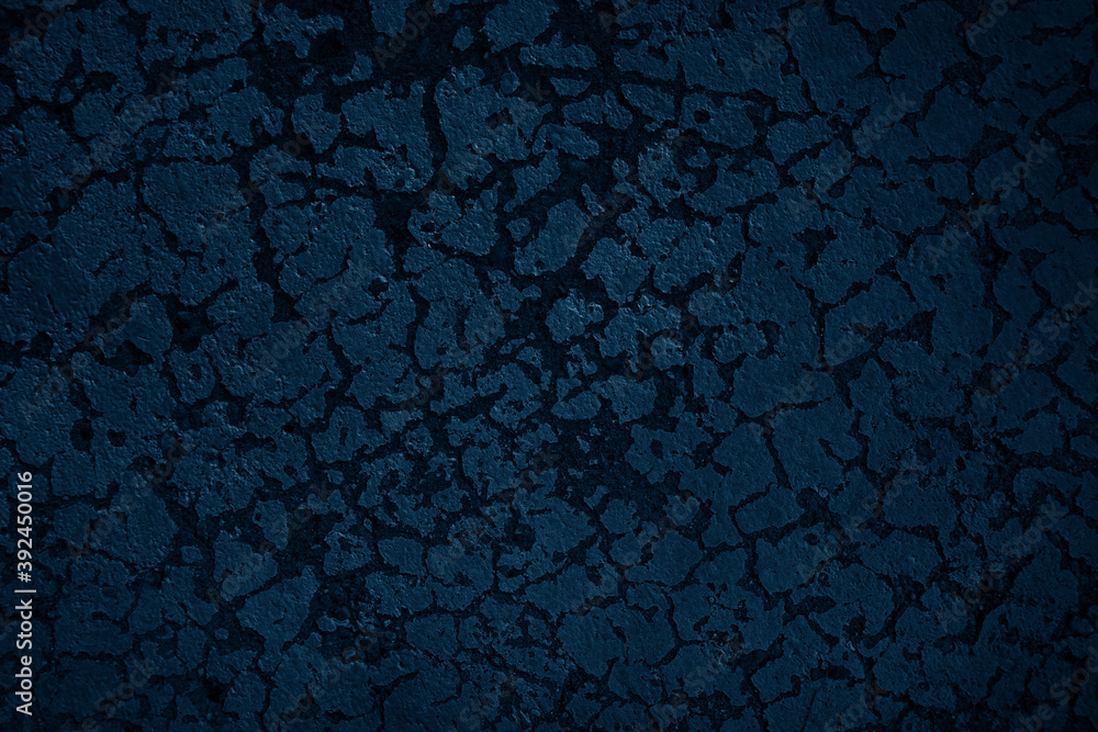 Dark blue textured wall.