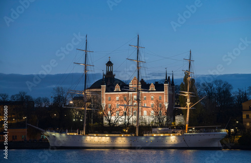 Night and dawn view over the yacht, admirals house and church on the island Skeppsholmen in Stockholm.