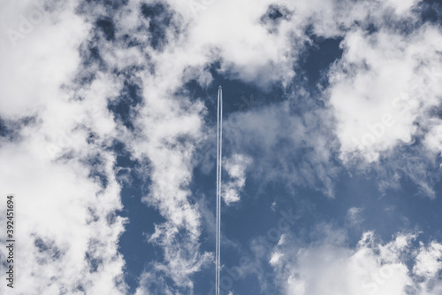 AIRPLANE IN THE BLUE SKY