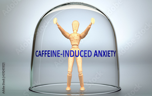 Caffeine induced anxiety  can separate a person from the world and lock in - pictured as a human figure locked inside a glass with a phrase Caffeine induced anxiety , 3d illustration photo