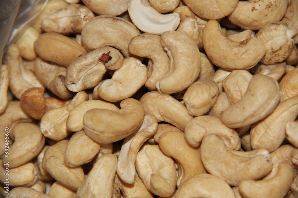 A scattering of cashew nuts. Crop of nuts. Background A scattering of cashew nuts. Crop of nuts. Background