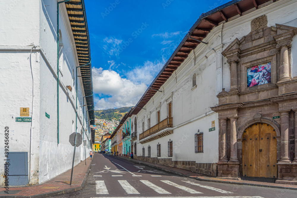 Ecuador.  Street in the historical city center of Quito. Boarded by typical houses. 
