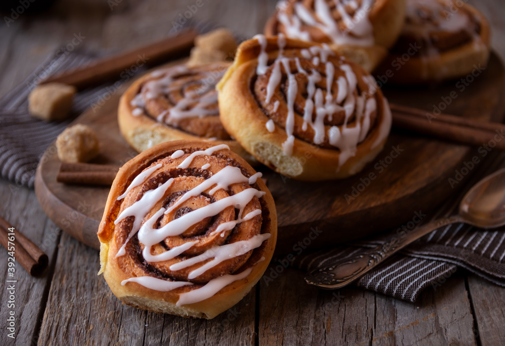 Fresh home baked sweet cinnamon buns with frosting Fresh home baked sweet cinnamon buns with frosting