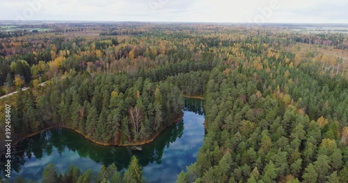 Sunset at blue lake. Beautiful autumn aerial footage. photo