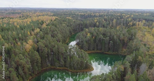 Sunset at blue lake. Beautiful autumn aerial footage. photo