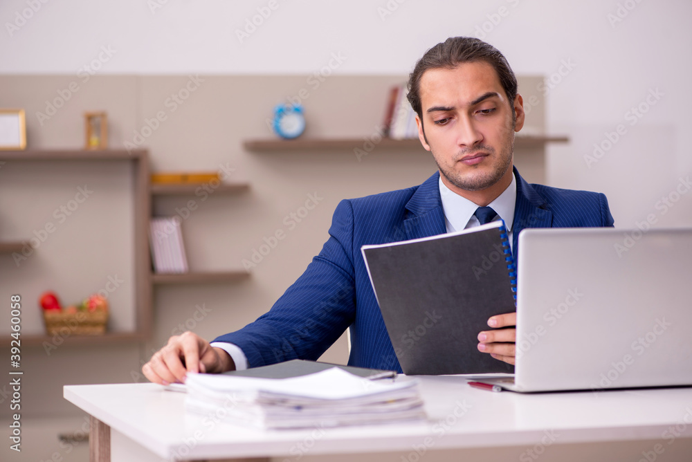 Young male employee working from home in pandemic concept Young male employee working from home in pandemic concept