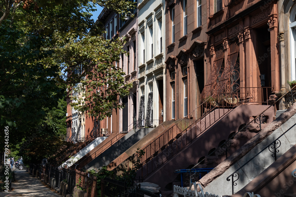 Row of Beautiful Old Brownstone Homes in Prospect Heights Brooklyn of New York City along the Sidewalk