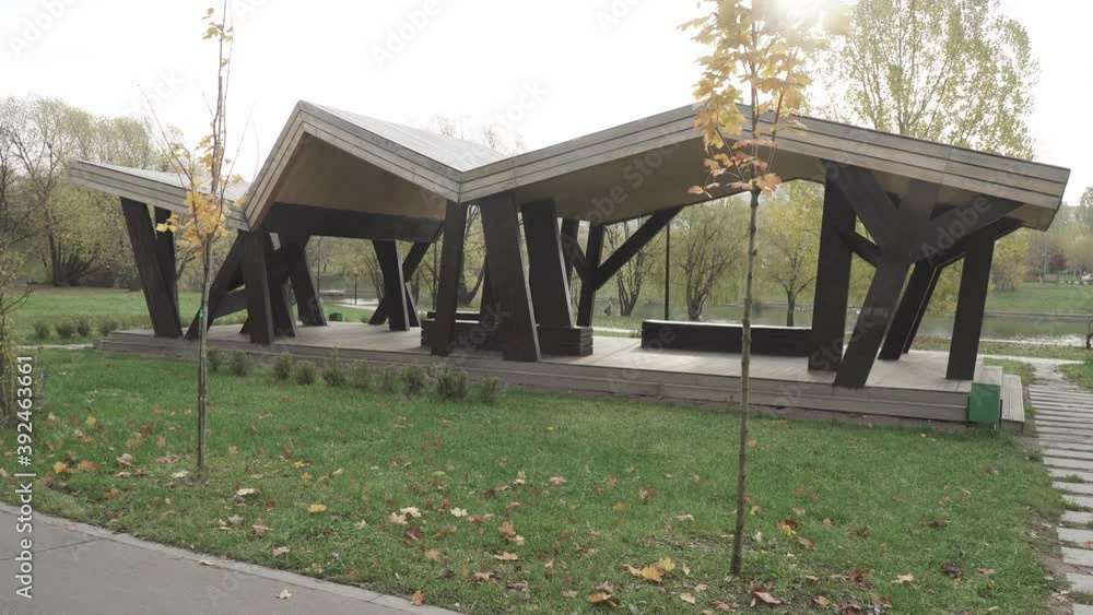 Wooden gazebo on the bank of the pond Wooden gazebo on the bank of the pond