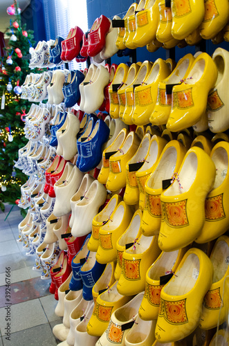 Kinderdijk, The Netherlands, August 2019. Souvenir Dutch clogs, produced in different shapes and colors, make a good show in the display.