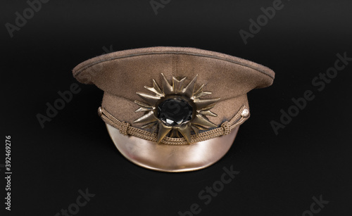 cap dictator, military gold cap isolated on black background photo