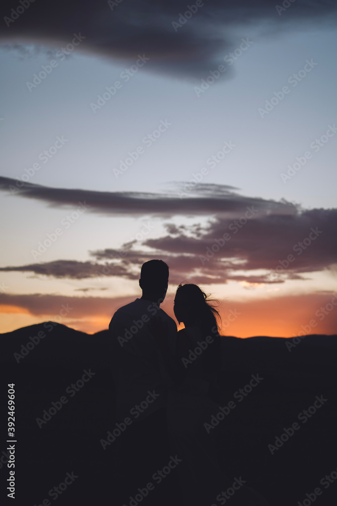 silhouette of couple on the beach