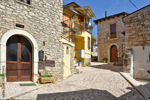 Fototapeta Naklejka Na Ścianę i Meble -  A narrow street among the old houses of Pietrelcina, a medieval village in the Campania region, Italy.