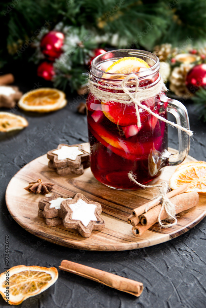 Christmas hot mulled wine with cinnamon cardamom and anise. Dark vintage dirty background. Creative atmospheric decoration Christmas hot mulled wine with cinnamon cardamom and anise. Dark vintage dirty background. Creative atmospheric decoration
