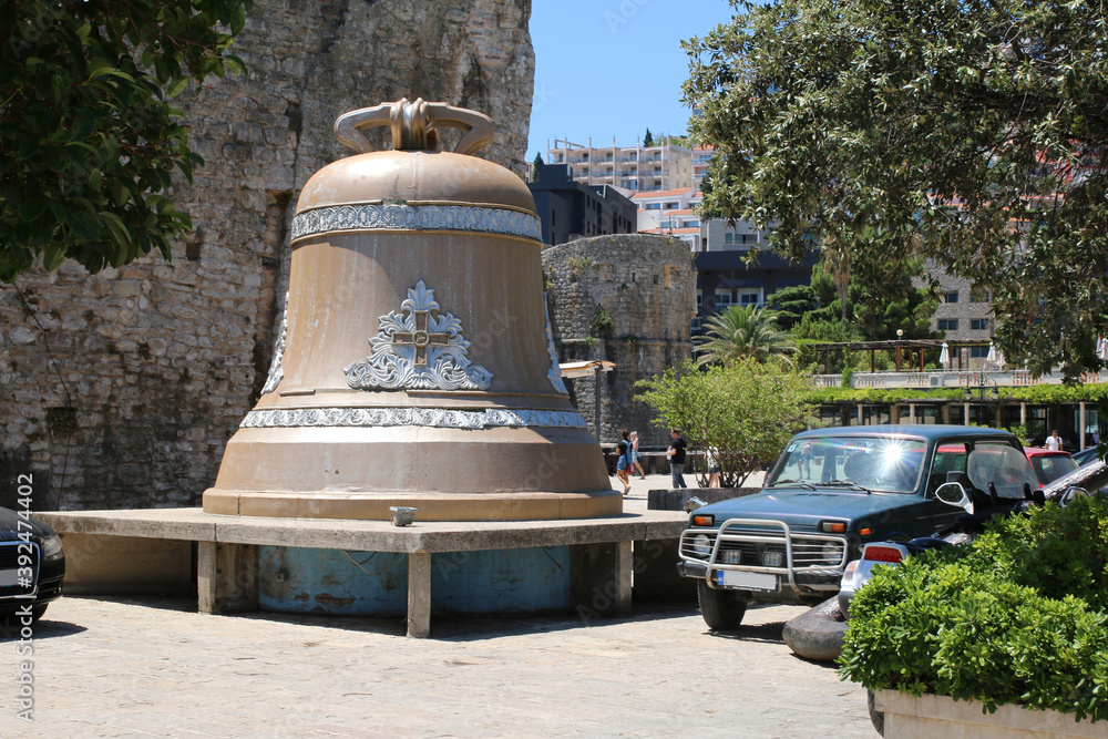 golden bell in the seaport, near the fortress wall of old Budva
