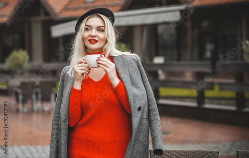 Woman at European cafe, plus size blonde nice woman . Pretty nice girl in restaurant at terrace with a cup of coffee, lifestyle ladies, tourist at Europe  photo