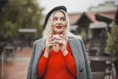 Woman at European cafe, plus size blonde nice woman . Pretty nice girl in restaurant at terrace with a cup of coffee, lifestyle ladies, tourist at Europe 