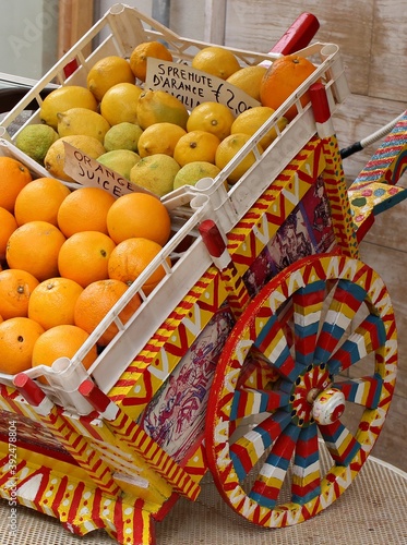 Italy, Sicily: Miniature of sicilian cart with Citrus.