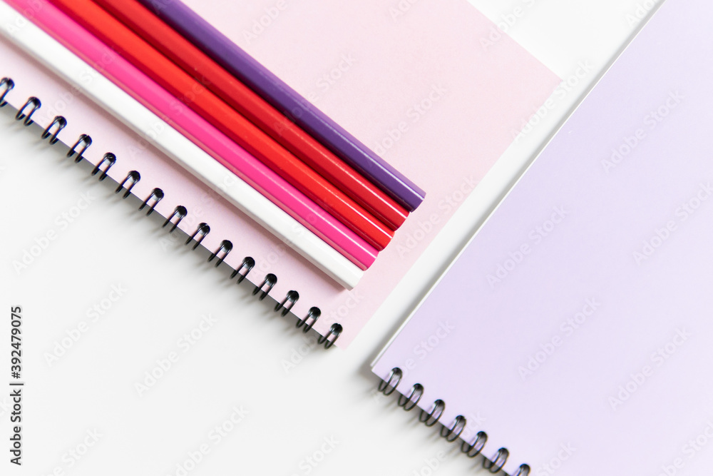 colored notebooks with pencils. colored notebooks with pencils.