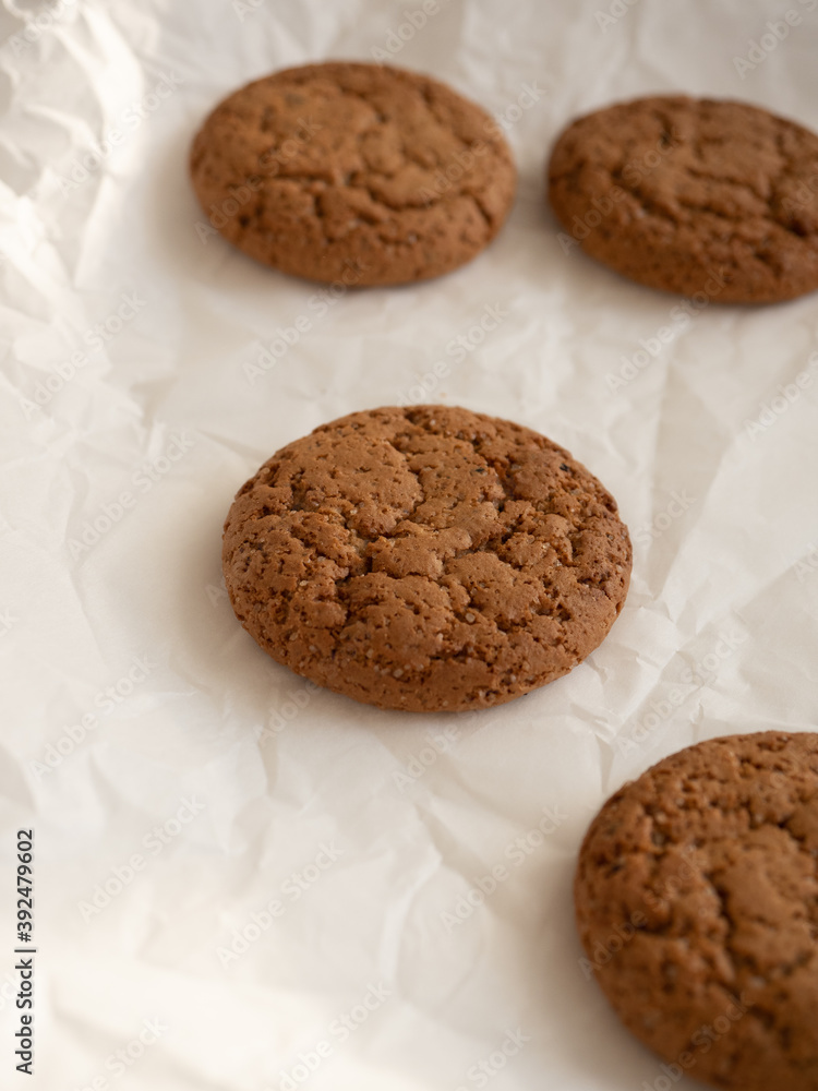 Oatmeal cookies on white background in morning light close up Oatmeal cookies on white background in morning light close up