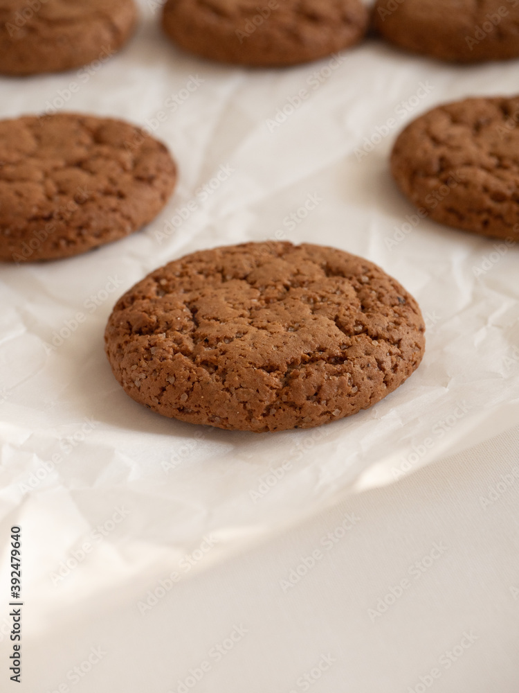 Oatmeal cookies on white background in morning light close up Oatmeal cookies on white background in morning light close up