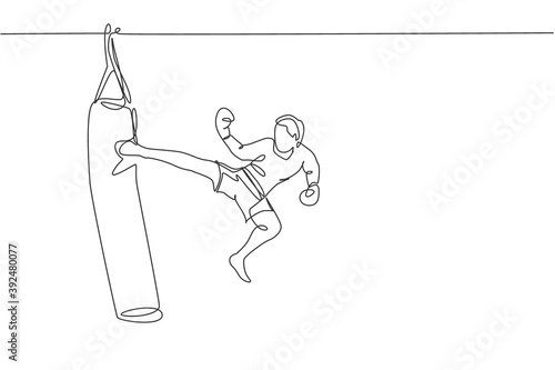 One single line drawing of young energetic man kickboxer practice jump kicking with punch bag in boxing arena vector illustration. Healthy lifestyle sport concept. Modern continuous line draw design