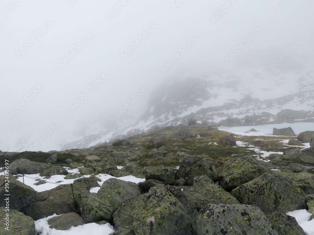 high mountain in fog