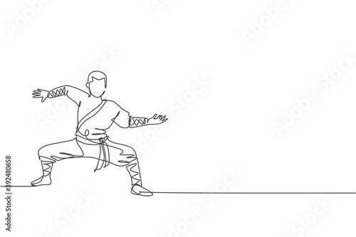 One continuous line drawing of young shaolin monk man practice kung fu style at temple ground . Traditional Chinese combative sport concept. Dynamic single line draw design vector graphic illustration