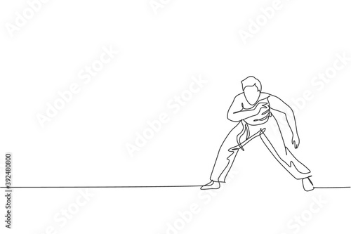 One single line drawing of young energetic man capoeira dancer perform dancing fight vector graphic illustration. Traditional martial art lifestyle sport concept. Modern continuous line draw design