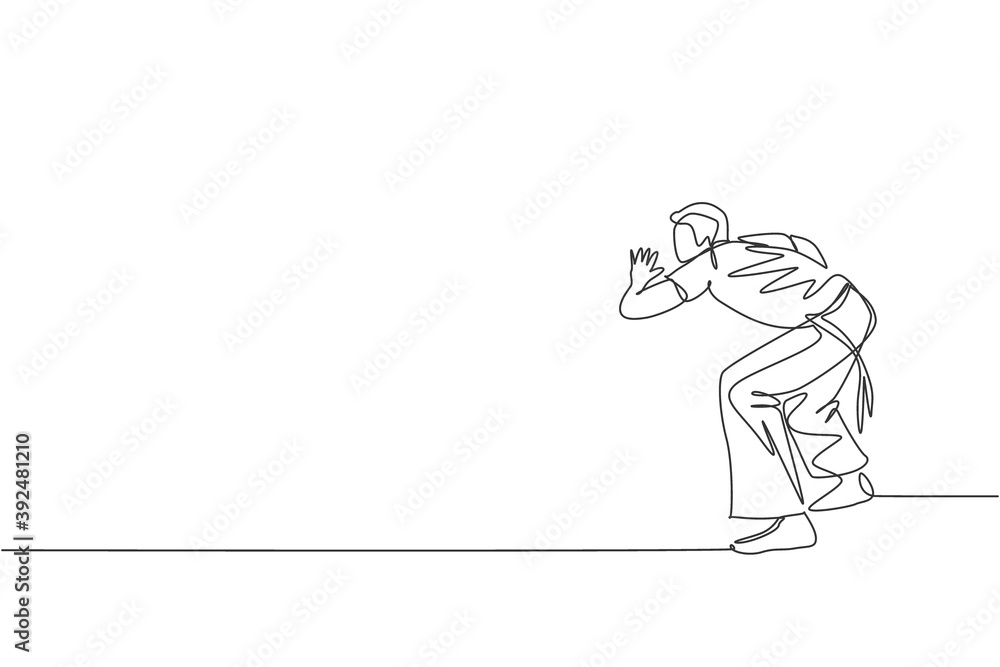Fototapeta premium Single continuous line drawing of young sportive man practice Brazilian capoeira move dance at outdoor street. Culture martial art and sport concept. Trendy one line draw design vector illustration