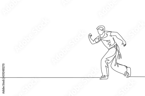 One continuous line drawing young sporty Brazilian fighter man training capoeira on the beach. Healthy traditional fighting sport concept. Dynamic single line draw graphic design vector illustration © Simple Line