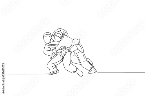 Single continuous line drawing of two young sportive judoka fighter men practice judo skill at dojo gym center. Fighting jujitsu, aikido sport concept. Trendy one line draw design vector illustration