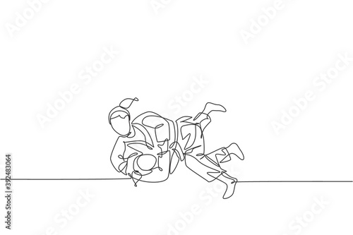 One single line drawing two young energetic judokas fighter women battle fighting at gym center graphic vector illustration. Martial art sport competition concept. Modern continuous line draw design
