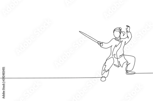 Single continuous line drawing of young woman wushu fighter, kung fu master in uniform training with sword at dojo center. Fighting contest concept. Trendy one line draw design vector illustration