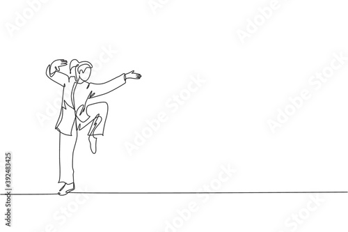 One continuous line drawing young wushu master woman, kung fu warrior in kimono pose stance balance on training. Martial art sport contest concept. Single line draw graphic design vector illustration