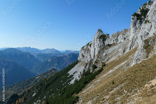 Panoramic view on mountains in Hochschwab region, Austrian Alps. The flora overgrowing slopes is golden. Autumn vibes in the mountains. Remote place, with no people. Freedom and wilderness © Chris