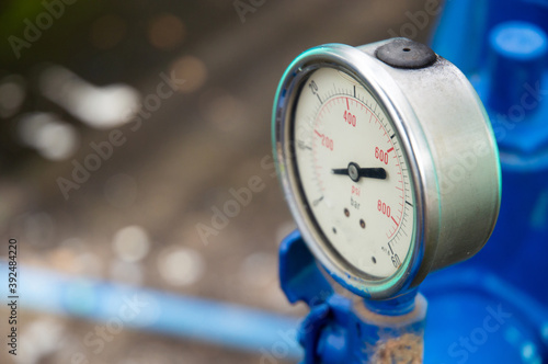Blue pressure gauge for measuring the pressure in the cooking gas tank in the gas refilling service point.