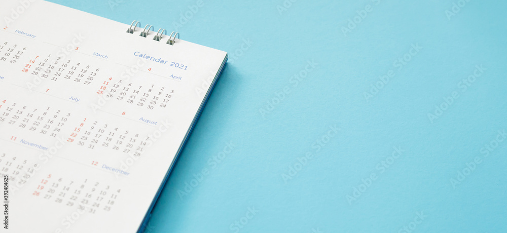 2021 calendar page on blue background business planning appointment meeting concept 2021 calendar page on blue background business planning appointment meeting concept