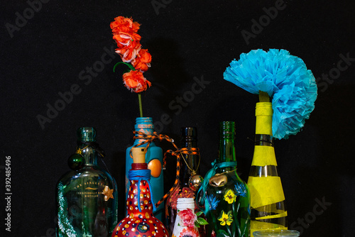 decorated bottles and artificial flowers