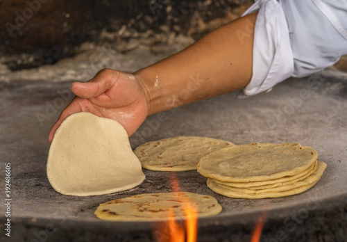 Black corn tortillas in comal. Guatemalan corn tortillas. Close up of tortillas in comal