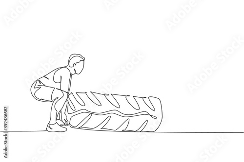 One continuous line drawing of young sporty man working out lift and push big heavy tire in fitness gym club center. Healthy fitness sport concept. Dynamic single line draw design vector illustration