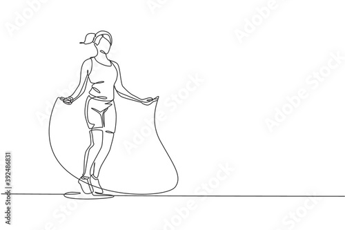 Single continuous line drawing young sportive woman train jumping with skipping rope in sport gymnasium club center. Fitness stretching concept. Trendy one line draw design vector illustration graphic
