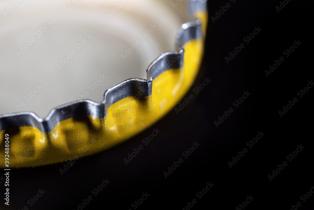 Close up reverse of a metal crown cap with copy space. Selective focus Close up reverse of a metal crown cap with copy space. Selective focus