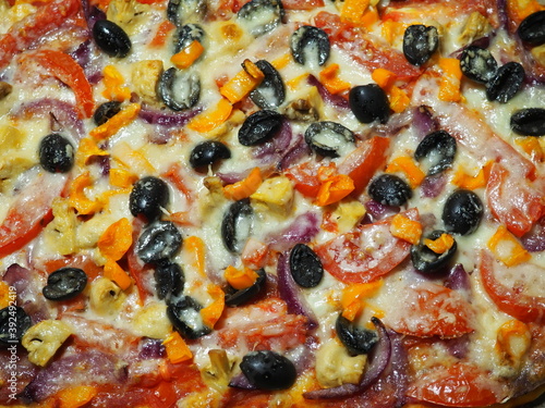 Pizza with mushrooms, olives, tomatoes, peppers, cheese, onion. Vegetarian pizza. Pizza ingredients.